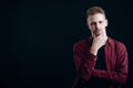 Thoughtful Young Handsome Man Rubbing His Chin Royalty Free Stock Photo