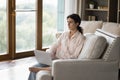 Thoughtful young Latin student girl distracting from work at laptop Royalty Free Stock Photo