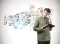 Thoughtful man with notebook and his business plan Royalty Free Stock Photo