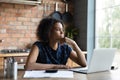 Thoughtful young mixed race african woman having financial troubles. Royalty Free Stock Photo