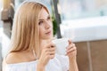 Thoughtful young woman drinking tea Royalty Free Stock Photo