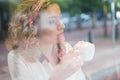 Thoughtful young woman having coffee in cafe Royalty Free Stock Photo