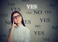 Thoughtful young woman making a YES choice Royalty Free Stock Photo