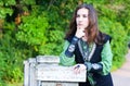 Thoughtful young woman in medieval suit