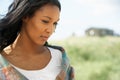 Thoughtful Young Woman Standing On Beach Royalty Free Stock Photo