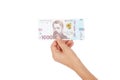 Thousand hryvnias by one banknote in the hand