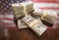 Thousands of Dollars with Reflection of American Flag on Table