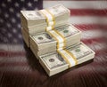 Thousands of Dollars with Reflection of American Flag on Table Royalty Free Stock Photo