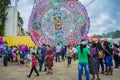 Thousands of people looking at the colorful kites with figures of the Virgin of Guadalupe