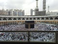 thousands of people perform towaf in front of the kaaba