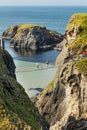 Tourists visiting Carrick-a-Rede Rope Bridge in County Antrim of Northern Ireland