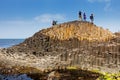 Thousands of tourists visiting Giant`s Causeway in County Antrim of Northern Ireland