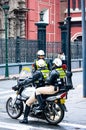 Thre Cosco`s policemen stand near the cross road in Cusco