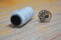 Thread reel for storing sewing thread on the inside of the sewing machine with the thread. Royalty Free Stock Photo
