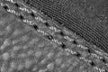 Thread seam on black leather material as background Royalty Free Stock Photo