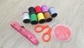 Sewing kit tools on wooden table Royalty Free Stock Photo