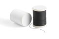 Thread spool on a white background. Basic color of thread: White, Black. Royalty Free Stock Photo