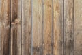 Threadbare clapboards texture. Old weathered wall of rustic barn covered with worn wooden planks for background. Royalty Free Stock Photo