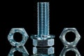 Threaded construction crown nut screwbolt bolt washer on black b Royalty Free Stock Photo