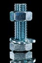Threaded construction nut screwbolt spring washer on black surfa Royalty Free Stock Photo