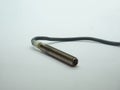 Threaded inductive proximity sensor with cable used in industrial automation