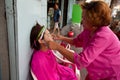 Threading (hair removal) in Chinatown Bangkok. Royalty Free Stock Photo