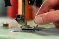 Threading the needle in a sewing machine. Royalty Free Stock Photo