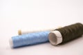 threads in different colours on white background Royalty Free Stock Photo