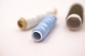 threads in different colours on white background - hand works Royalty Free Stock Photo