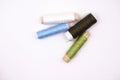 threads in different colours on white background Royalty Free Stock Photo