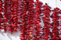 Threads with drying red hot peppers