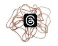 Threads mobile app icon with sackcloth threads on white background close-up. Threads service abstract concept. Meta
