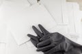 Threat envelope: the Protective gloves to suit chemical and biological defense are on the table with anonymous envelopes that have