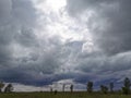 A threatening dark sky with heavy clouds over the steppe expanses