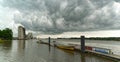 Threatening rain cloud over the river Weser and the port of Brake Unterweser, Germany