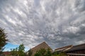Threatening sky when a thundercloud passes over a town Royalty Free Stock Photo