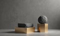 Three abstract sculptures, including large gray rock, smaller gray rock, and golden rectangular base, are Royalty Free Stock Photo