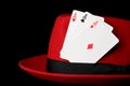 Three aces on felt hat; concept for gambling Royalty Free Stock Photo