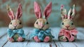 Three Adorable Fabric Bunnies Sitting on Wooden Table Royalty Free Stock Photo