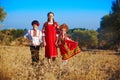 Three adorable kids in folk Russian costume and headdresses