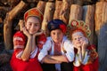 Three adorable kids in folk Russian costume and headdresses
