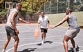 Three african american men playing basketball on a court outdoors. Black man and his sporty friends being athletic Royalty Free Stock Photo