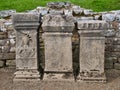 Three altars at the Temple of Mithras near Hadrian`s Wall at Carrawburgh in Northumberland, England, UK.