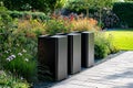 Three aluminium gargage bins standing in a garden Royalty Free Stock Photo