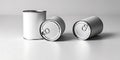 three aluminum cans with pull-tab tops are arranged on a flat surface. Royalty Free Stock Photo