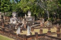 Three ancient Buddha sculptures in the ruins of the temple Wat Phra Kaeo. Sunny day. Kamphaeng Phet, Thailand Royalty Free Stock Photo