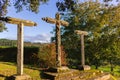 Three ancient crosses on monastery yard. Stone old crucifix. Catholic monastery landmark. Christianity symbols. Medieval cemetery. Royalty Free Stock Photo