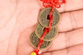 Three ancient Feng shui metal lucky coins on the hand Royalty Free Stock Photo