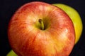 Three apples, one green and two red and yellow on a dark background Royalty Free Stock Photo