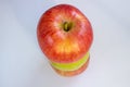 Three apples, one green and two red-yellow on a light background Royalty Free Stock Photo